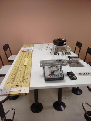The giant slide rule, calculators, and various storage media.
