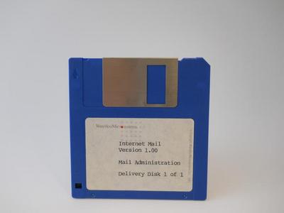 A blue 3 1/2 inch floppy disk used as a Delivery disk for the internet mail server at Waterloo Microsystems in 1987.