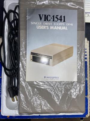 Photo of the VIC-1541 Disk drive and manual